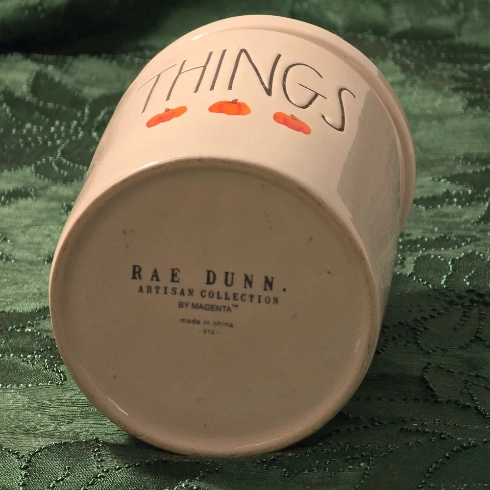 Rae Dunn Cream Jar with Orange Pumpkin Accents with 'THINGS'‎ text.